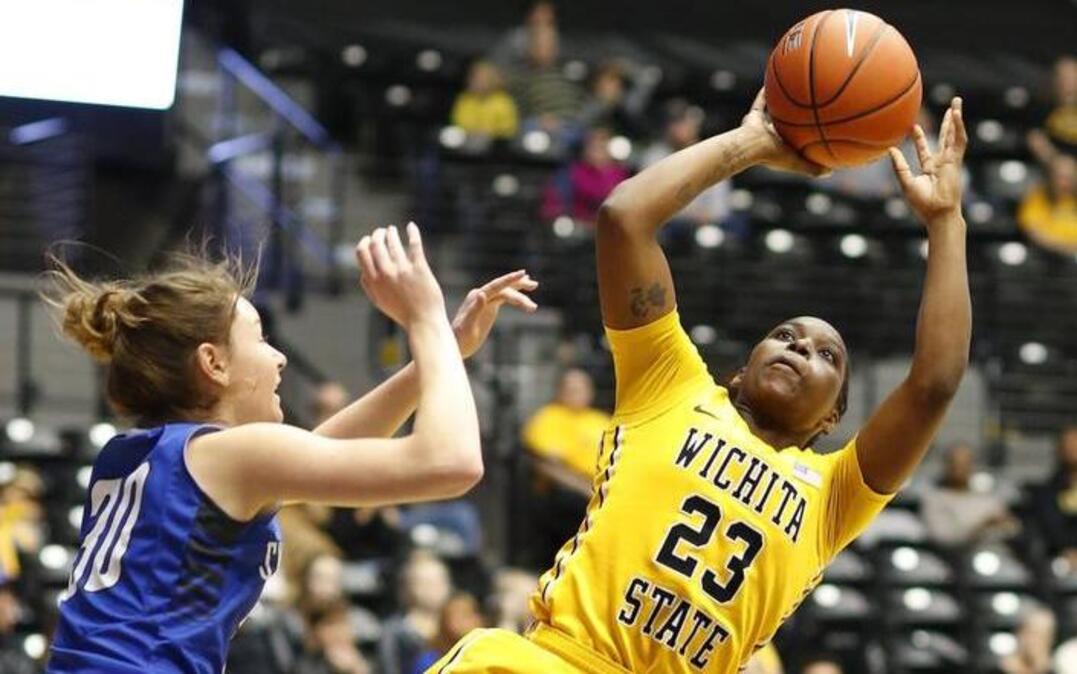 Wichita State's TaQuandra Mike takes an off-balance shot against Indians State in the second quarter Sunday at Koch Arena.