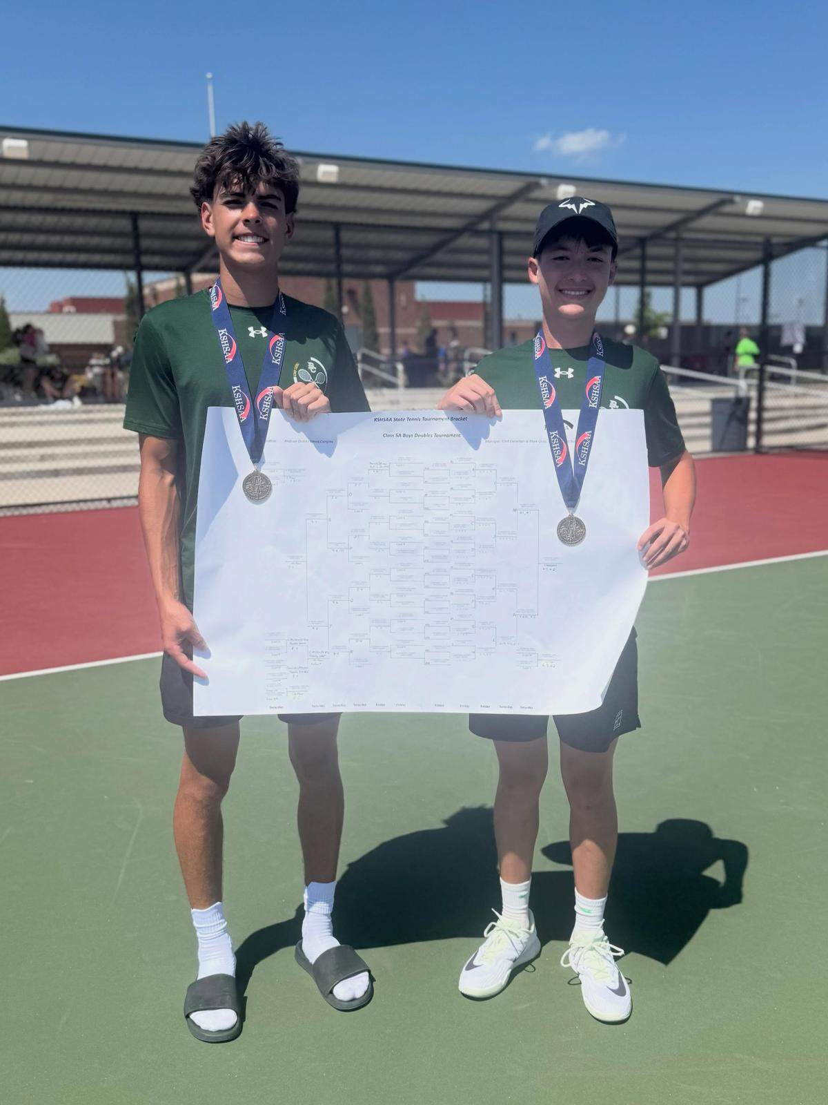 Bishop Carroll senior Gabe Weber (left) and Braeden Dugan (right) completed a perfect 31-0 season by winning the Class 5A doubles championship.