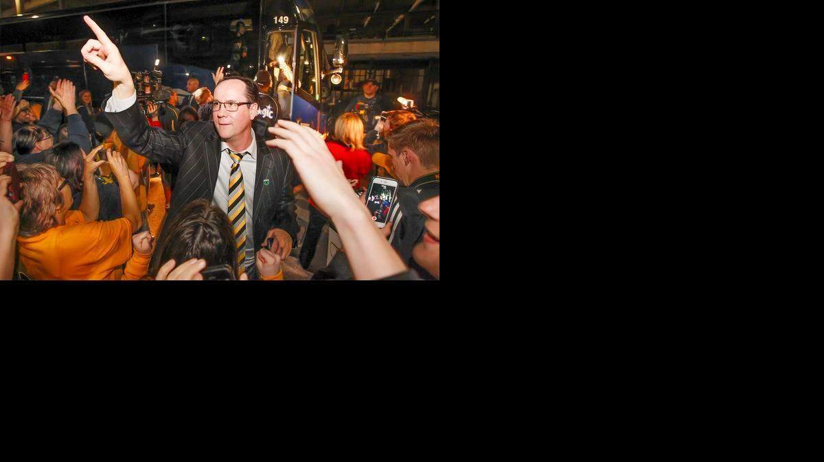 
Wichita State coach Gregg Marshall is welcomed by fans at Koch Arena after the team arrived from Omaha. WSU beat Kansas 78-65 to advance to the Midwest Regional semifinals.
