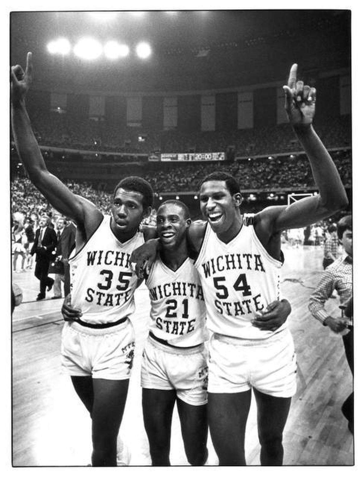Shockers Antoine Carr (35), Tony Martin (21) and Cliff Levingston (54) leave the Louisiana Superdome court after Wichita State defeated Kansas 66-65 in the 1981 Midwest Regional semifinals.
