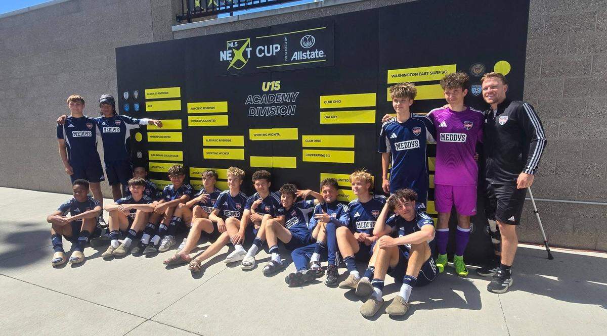 Sporting Wichita Academy’s U15 boys team poses in front of the MLS Next Cup bracket after winning the national championship Saturday in Salt Lake City, finishing a perfect 28-0 season.