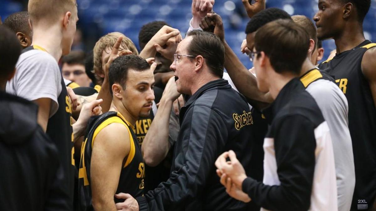 Gregg Marshall talks with his team at the end of their practice at UD Arena a day before the Shockers’ First Four game against Vanderbilt.