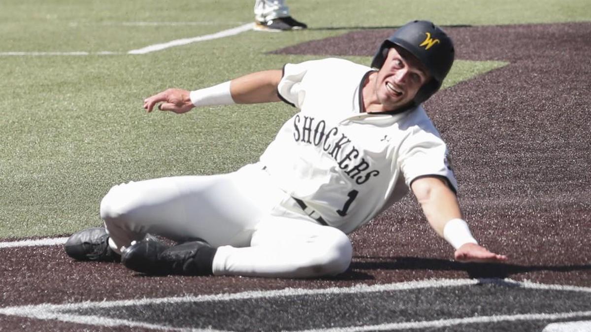 Wichita State’s Travis Young slides home in the eighth inning of the Shockers’ win over Evansville on Sunday at Eck Stadium.