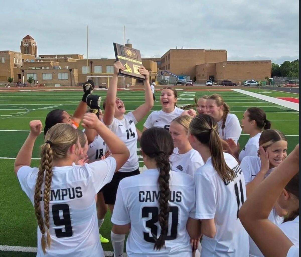 The Campus girls soccer team wildly celebrates the program’s first regional championship trophy in more than two decades after a 2-0 win over No. 1 seed Wichita North on Thursday.