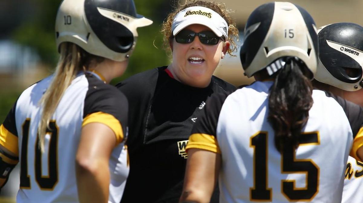 Wichita State coach Kristi Bredbenner talks to her team during a break in the action of Game 1 Saturday as the Shockers took on Southern Illinois at Wilkins Stadium.