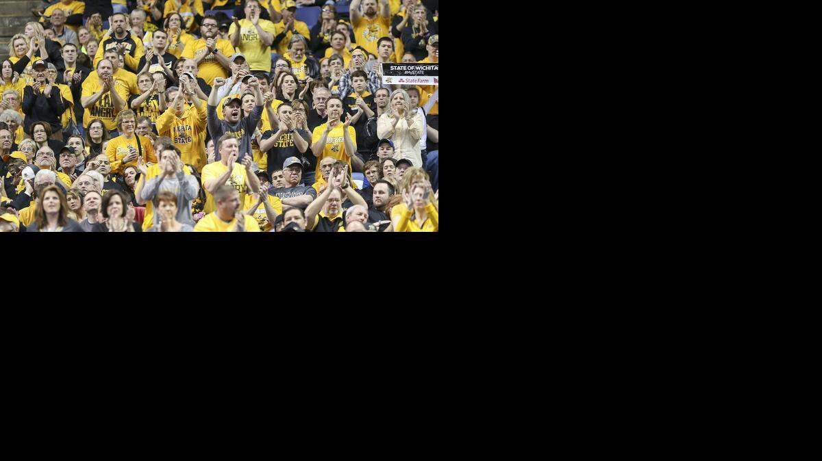 
Wichita State fans cheer on the Shockers late in the second half during their semifinal game the MVC Tournament in St. Louis last March. (March 8, 2014)
