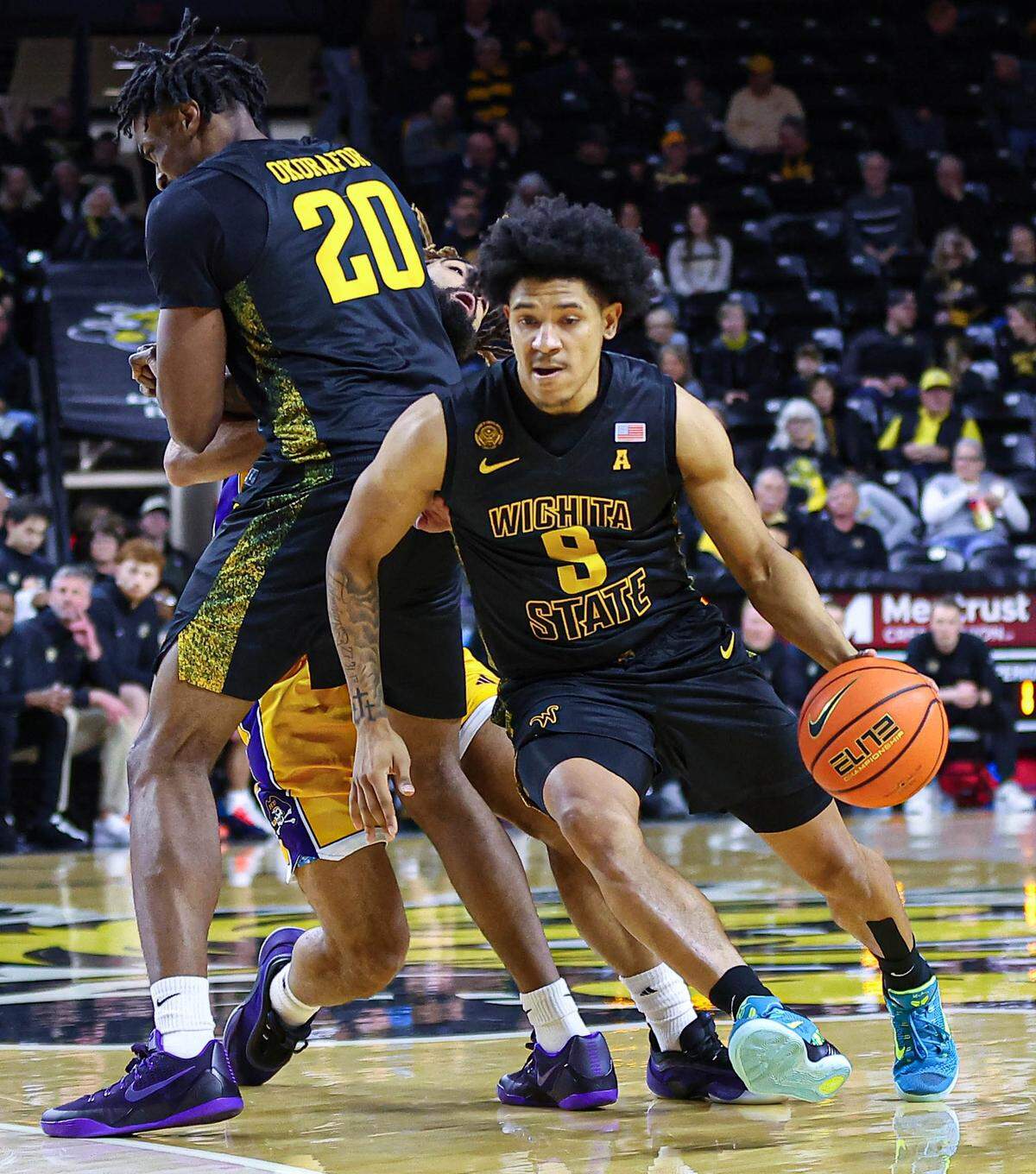 Mike Gray Jr. works the pick-and-roll game with Emmanuel Okorafor in a game against East Carolina at Koch Arena.