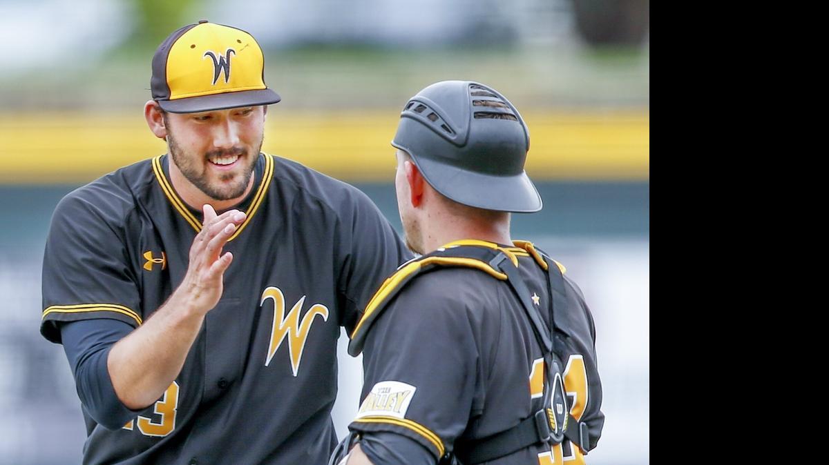 
Wichita State pitcher John Hayes gets congratulated by catcher Bob Arens after the final out against Evansville at Eck Stadium Saturday. The Shockers won 10-7. Hayes got the save. 

