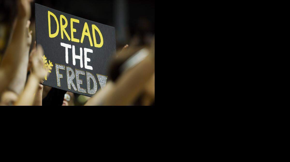 
A Wichita State fan holds a poster that says "Dread the Fred!" referring to WSU point guard Fred VanVleet during the game against Bradley at Koch Arena last January.
