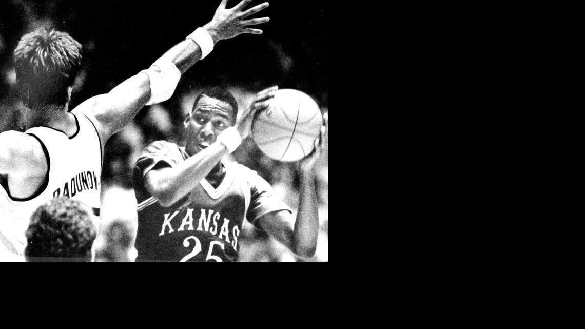 
Kansas forward Danny Manning (25) looks for a hole to put up a shot in the first half as WSU's Sasha Radunovich defends in the Shockers’ 54-49 victory on Jan. 6, 1987.

