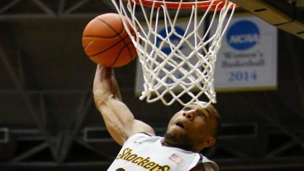 
Wichita State senior Tekele Cotton winds up for a dunk in the final minutes of Saturday’s game at Koch Arena.
