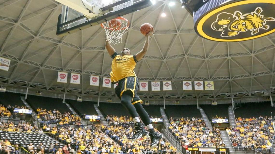 Wichita State's Darius Carter dunks two balls as he wins the dunk contest during 2014 Shocker Madness at Koch Arena. Carter has departed, so a new dunk champion will be crowned Thursday night during Shocker Madness.