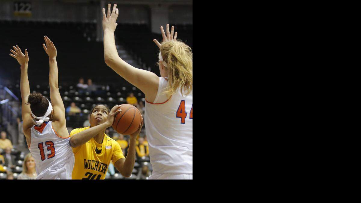 
Wichita State’s Alex Harden tries to shoot against the defense of Texas-Arlington's Rebekah Van Dijk, right, and LaShanda Green during the first half of their game at Koch Arena on Saturday.
