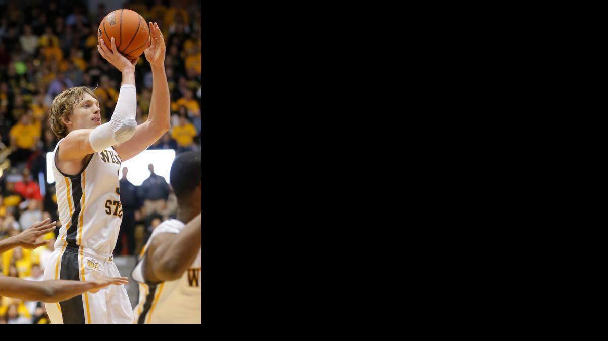 
Ron Baker hits a three-pointer that ignites WSU’s second-half run against Bradley on Wednesday night. 
