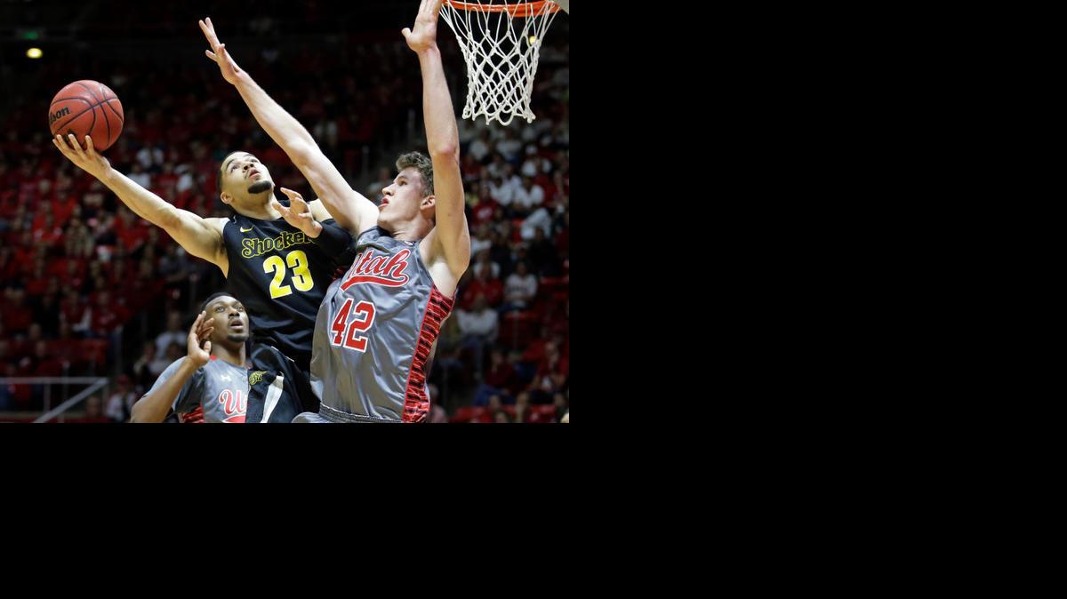 
Wichita State guard Fred VanVleet (23) shoots as Utah forward Jakob Poeltl defends in the first half Wednesday in Salt Lake City. 
