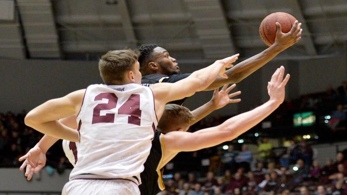 Wichita State forward Markis McDuffie grabs a rebound from SIU forward Rudy Stradnieks (24) during the second half Wednesday at SIU Arena in Carbondale, Ill.