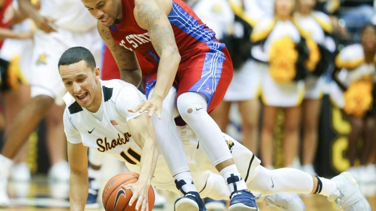 Wichita State guard Landry Shamet fights for a loose ball against South Carolina State guard Ed Stephens on Friday night. College basketball defenders have been warned to keep their hands off offensive players this season.