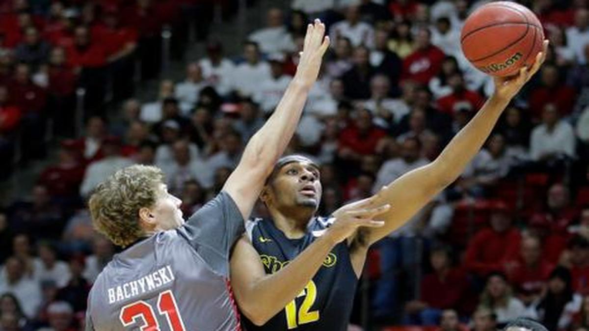 
Wichita State senior Darius Carter shoots as Utah’s Dallin Bachynski on Wednesday in Salt Lake City. Carter’s inside play helps keep the offense flowing; his absence against the Utes slowed the attack.
