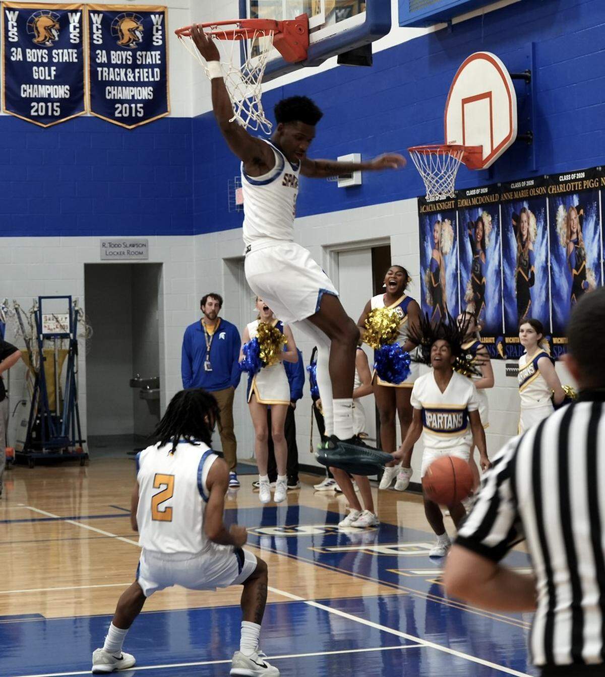 Collegiate basketball star Sebastian Hines-Turner dunks the ball in a game earlier this season for the Spartans.