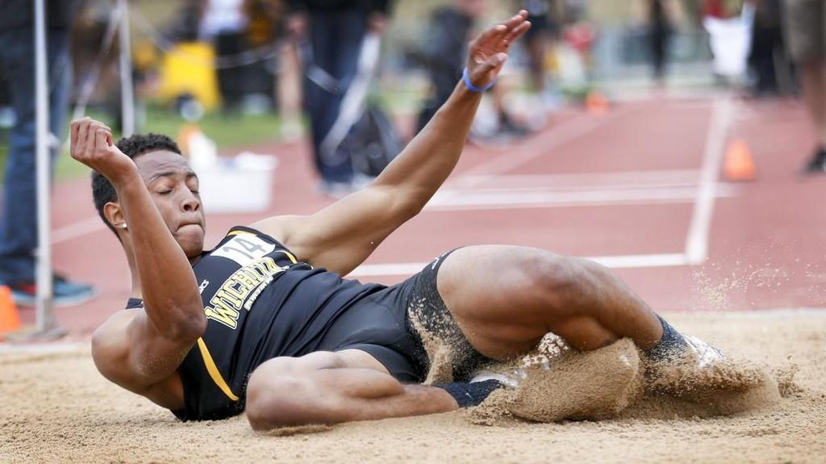 Wichita State’s Jared Berardo jumps lands in the triple jump pit Saturday at the KT Woodman Meet at Cessna Stadium. He jumped a personal-best 52 feet, 6 inches.
