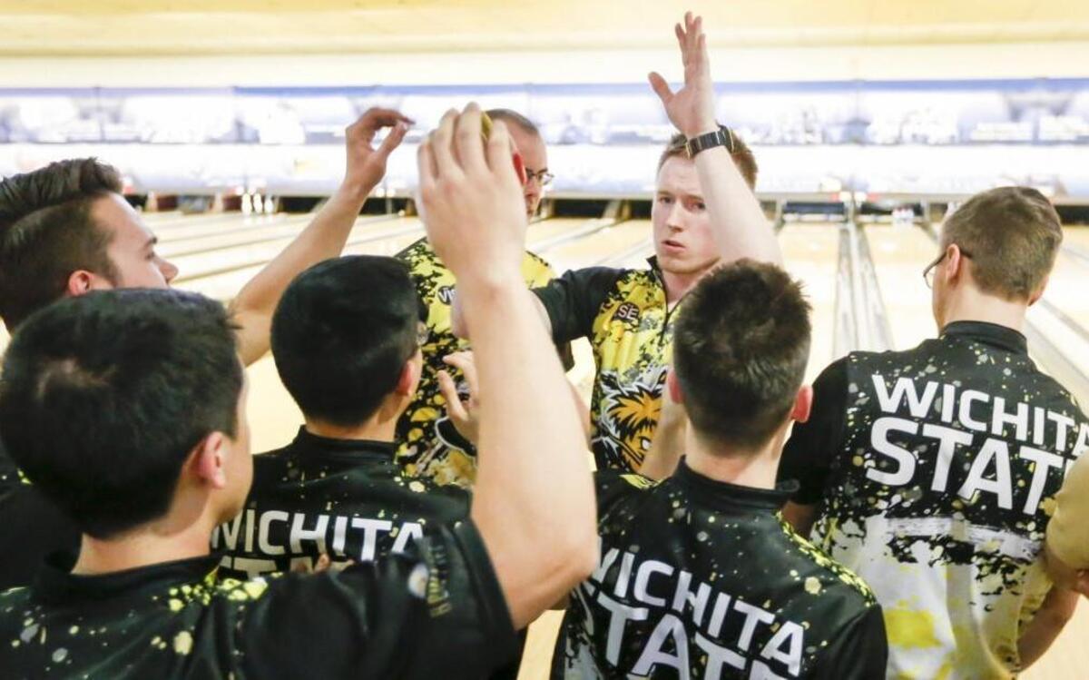 Wichita State bowlers congratulate A.J. Chapman after a strike during a match against Robert Morris at the team championships Friday at Northrock Lanes, WSU’s fourth match of the day. The Shockers won four in a row, but were eliminated in the tournament semifinals.
