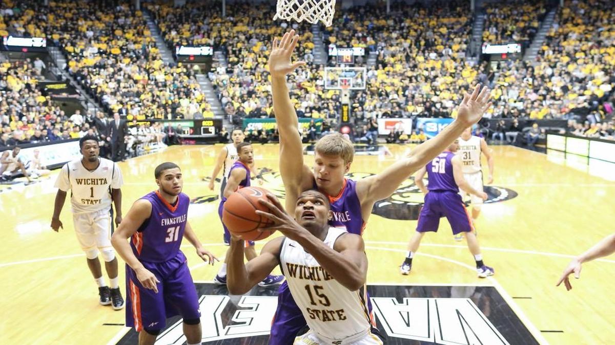 Wichita State’s Anton Grady looks to shoot against Evansville center Egidijus Mockevicius during the teams’ first meeting this season Jan. 6. The Aces gave the Shockers their toughest MVC game so far this season.