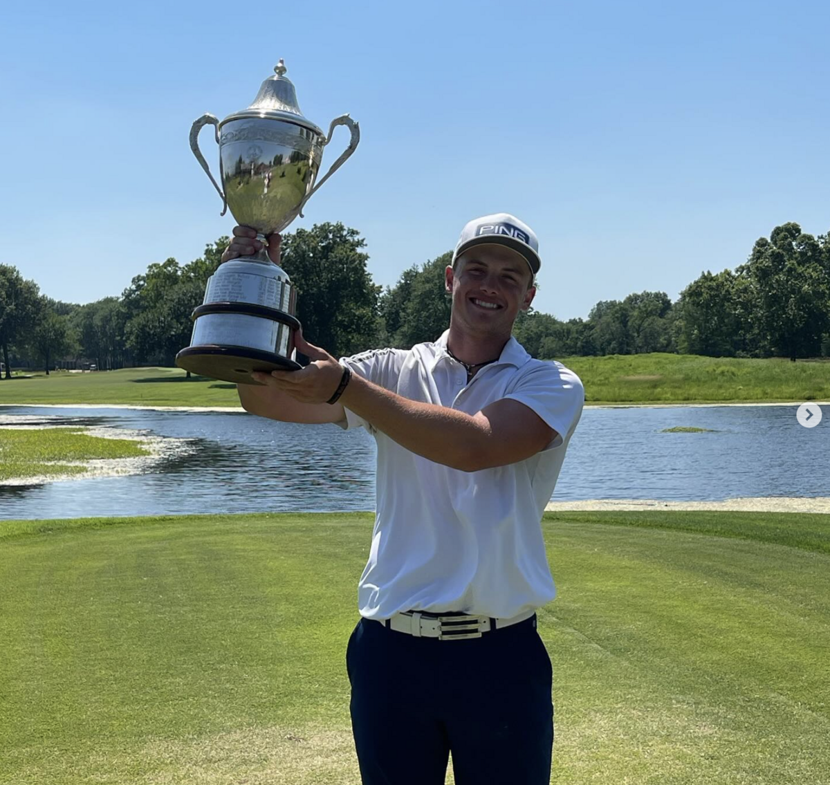 Asher Whitaker poses with the trophy after winning the 2024 Kansas Junior Amateur. The Wichita native took the early lead at the Kansas Amateur on Tuesday with a record-tying 8-under round of 62.