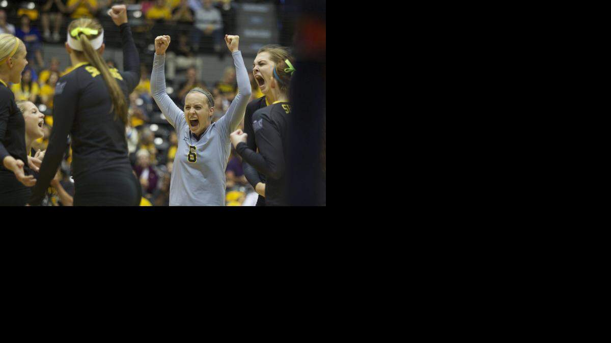 
Wichita State's Dani Mostrom celebrates with teammates after the Shockers scored a point against Indiana State.
