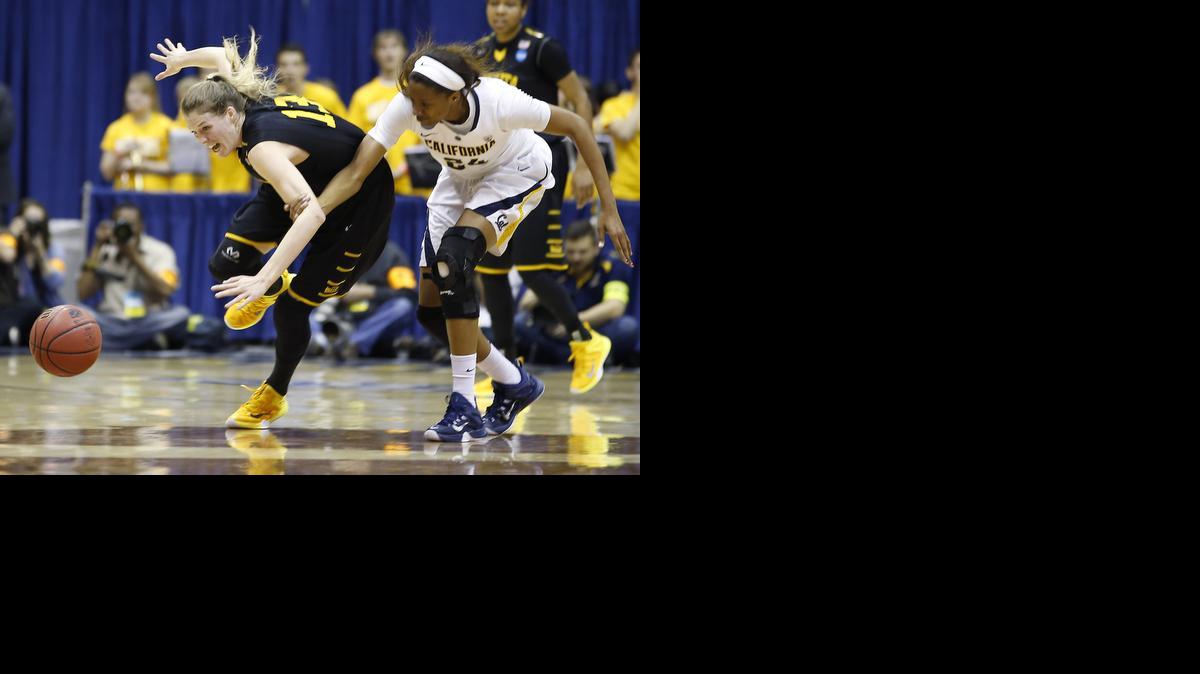 
Wichita State forward Kelsey Jacobs (13) battles for the ball against California forward Courtney Range (24) during the first half of Cal’s 78-66 victory.
