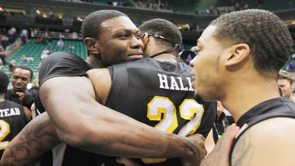 Cleanthony Early, left, hugs teammate Carl Hall after Wichita State beat Gonzaga to advancing to the West Regional semifinals in 2013.