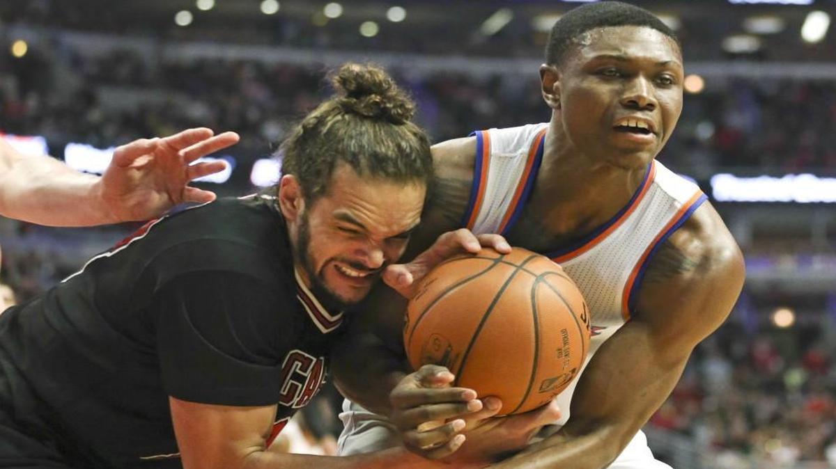
Former Shocker Cleanthony Early, right, battles Chicago’s Joakim Noah for a loose ball last March. 