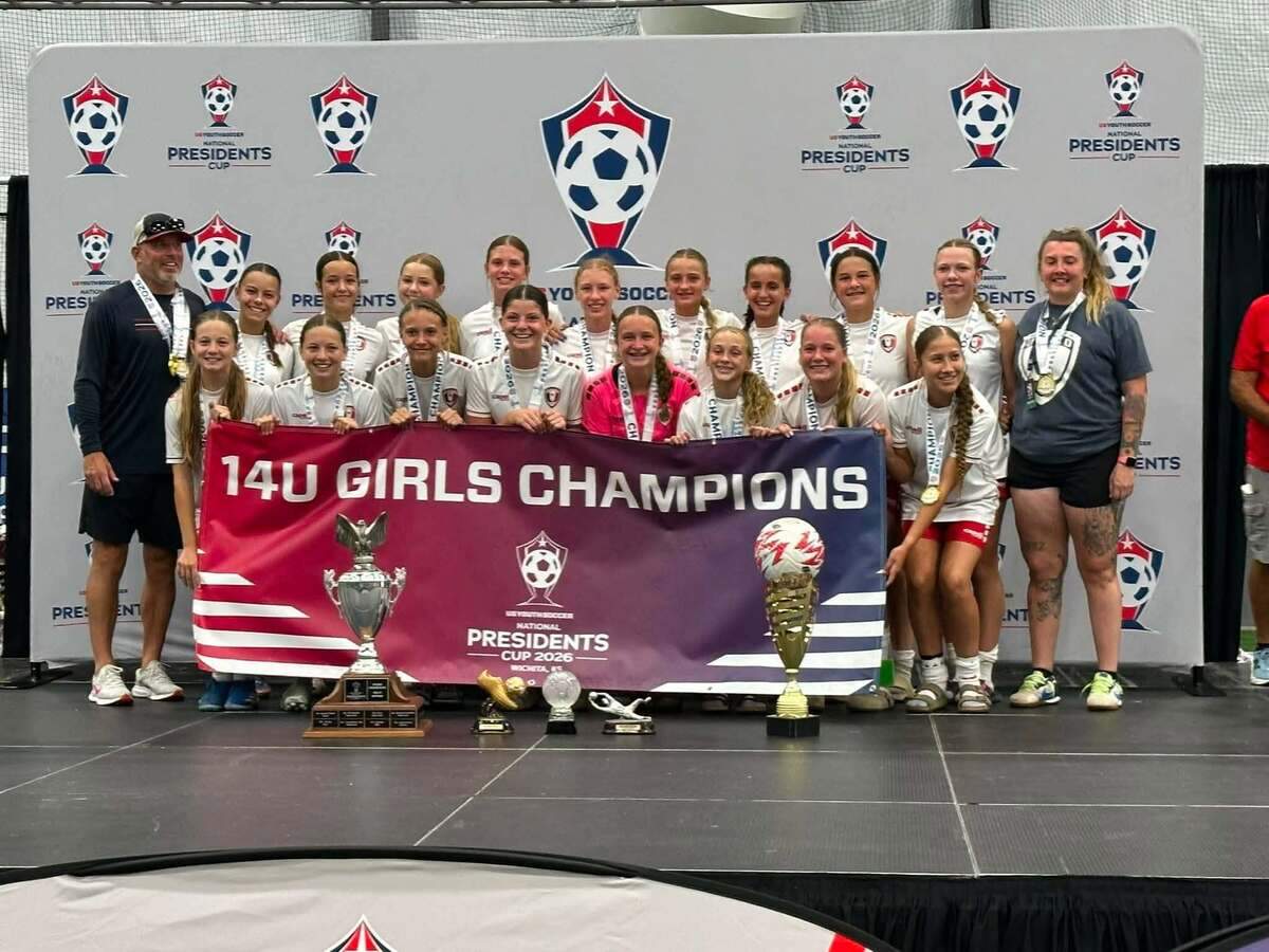 Members of the 2012 Blaze Academy celebrate after winning the 14U girls championship at the US Youth Soccer National Presidents Cup on Saturday at Scheels Stryker Sports Complex in Wichita.