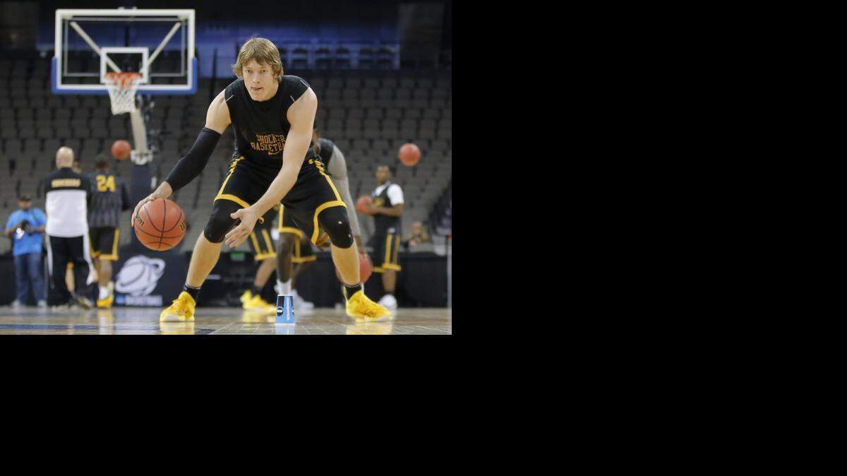 
Wichita State's Ron Baker does a ball-handling drill during the Shockers’ open practice at the CenturyLink Center in Omaha on Thursday. Wichita State will face Indiana on Friday.
