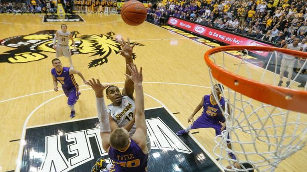 
Wichita State forward Darius Carter shoots over Northern Iowa forward Seth Tuttle during the second half of their game Sunday at Koch Arena.
