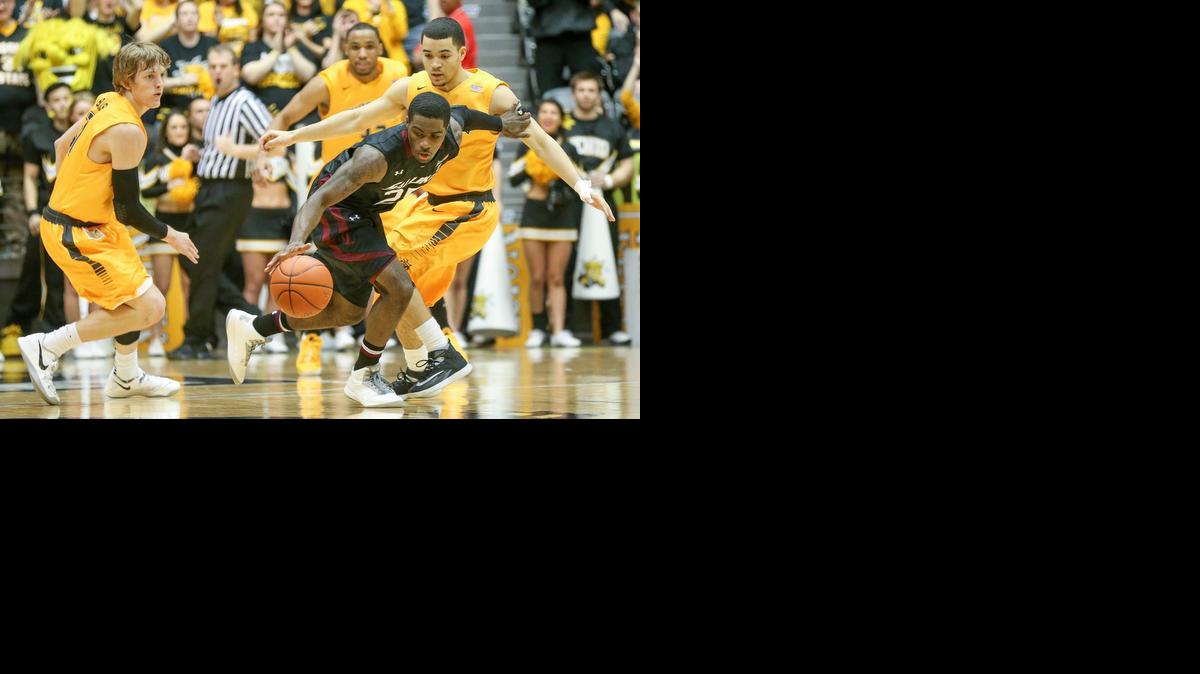 
Wichita State's Ron Baker, left, and Fred VanVleet pressure Southern Illinois guard Anthony Beane in the second half at Koch Arena on Feb. 11, 2014. 

