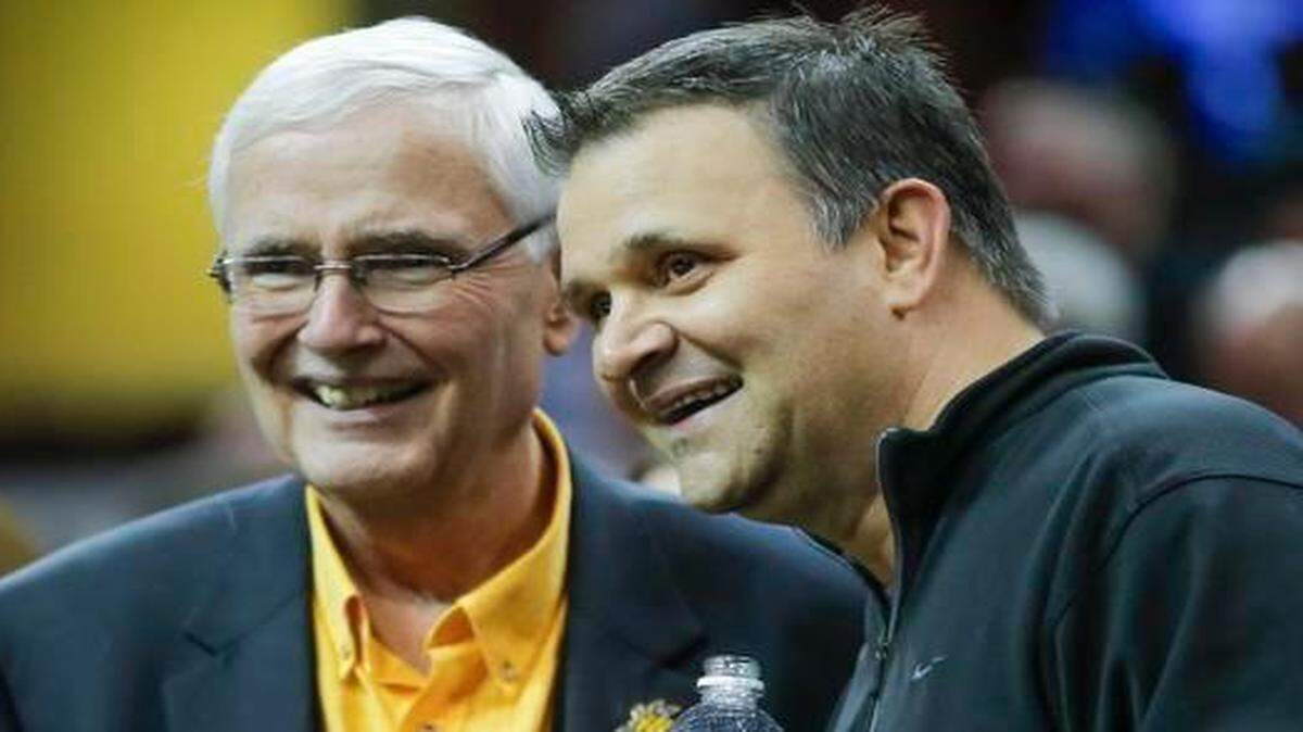 
Chris Jans, right, visits with WSU president John Bardo before WSU’s second-round NCAA Tournament game. Jans was fired as Bowling Green coach on Thursday.
