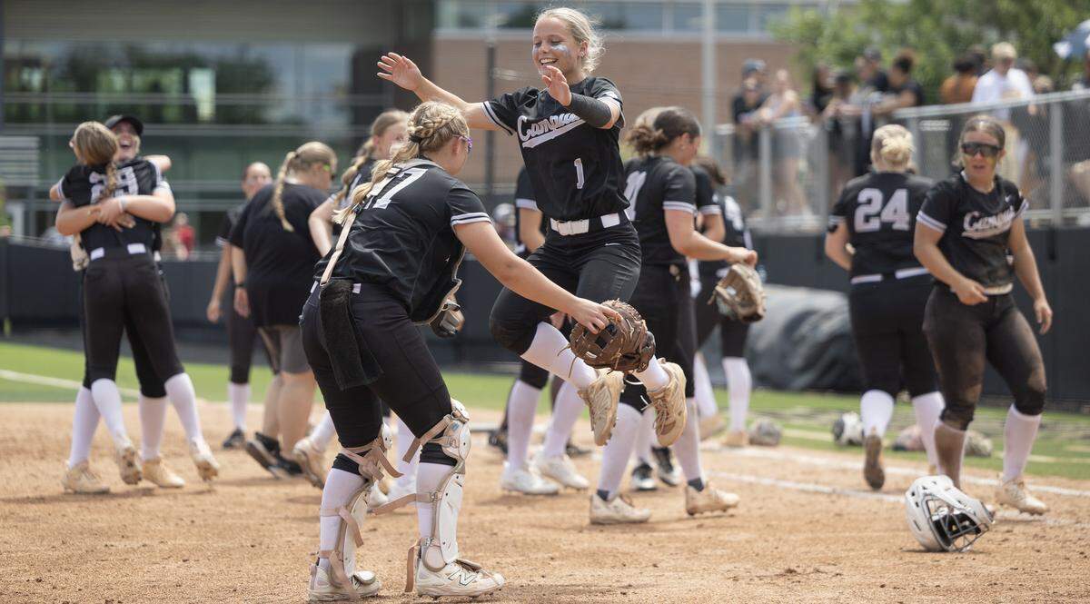 Campus sophomore Chloe Harris celebrates with senior catcher Kyra Caudillo after the Colts won 7-2 over Mill Valley in the Class 6A semifinals on Friday.