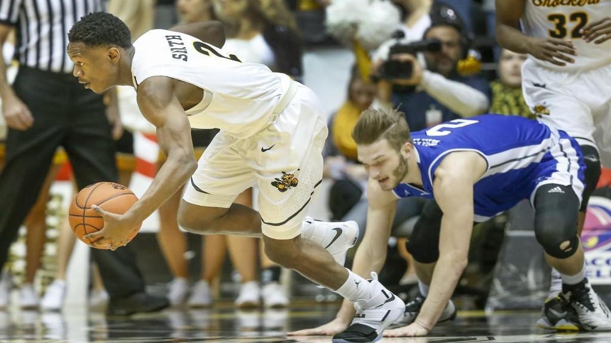 Wichita State’s Daishon Smith steals the ball against Drake’s Billy Wampler during the first half Wednesday at Koch Arena.