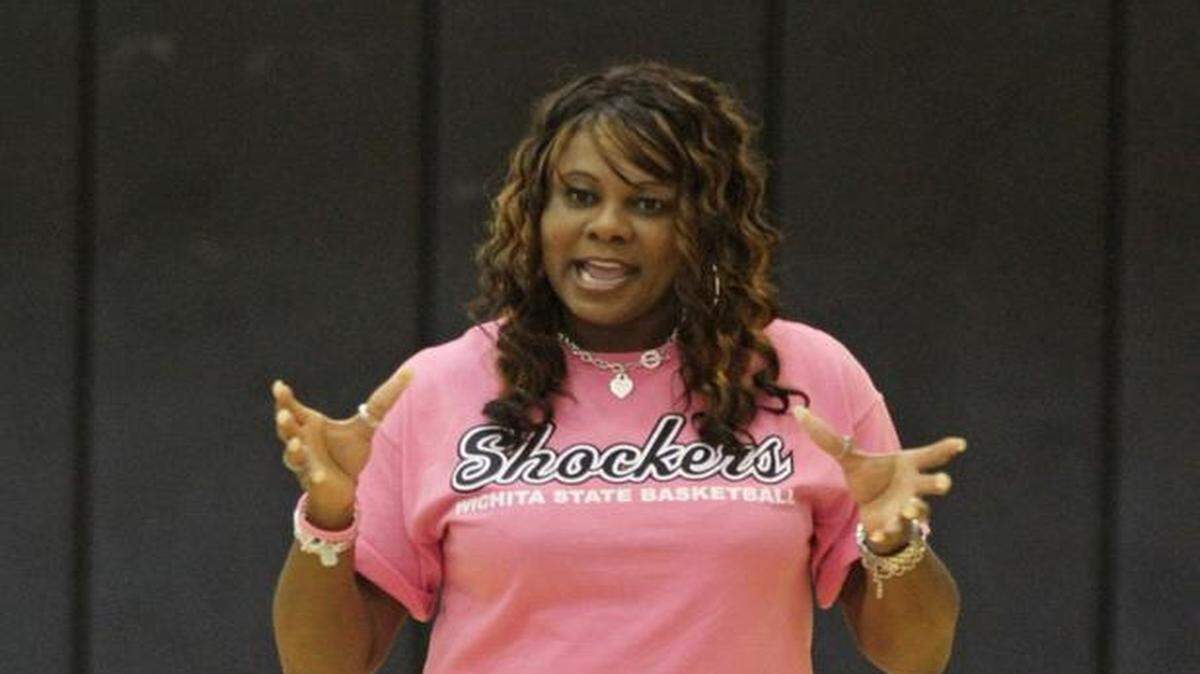 Former Wichita State assistant coach Bridgette Gordon talks with girls at the WSU basketball camp in 2010.