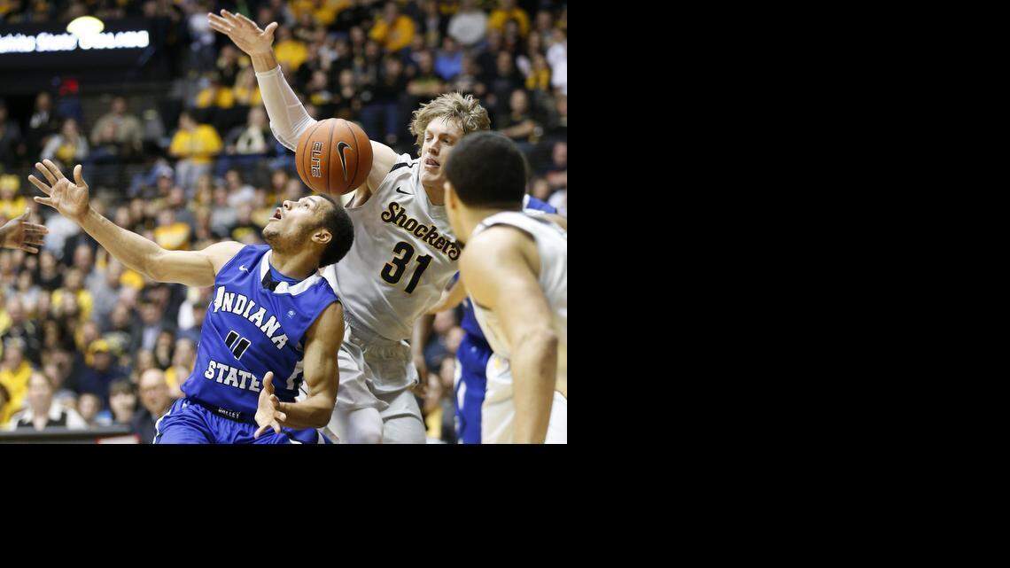 
Indiana State's Brenton Scott, left, loses the ball to Wichita State's Ron Baker in the first half.
