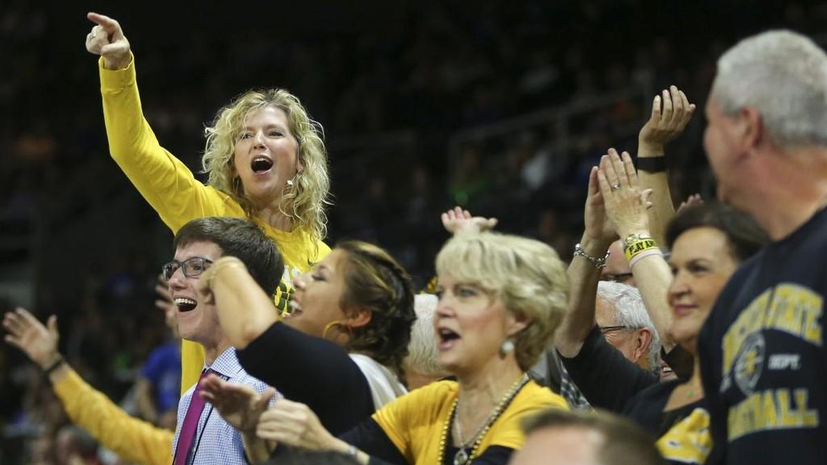 Lynn Marshall cheers along with other fans as the Shockers dominate Arizona during second half at Dunkin Donuts Arena in Providence on Thursday night.