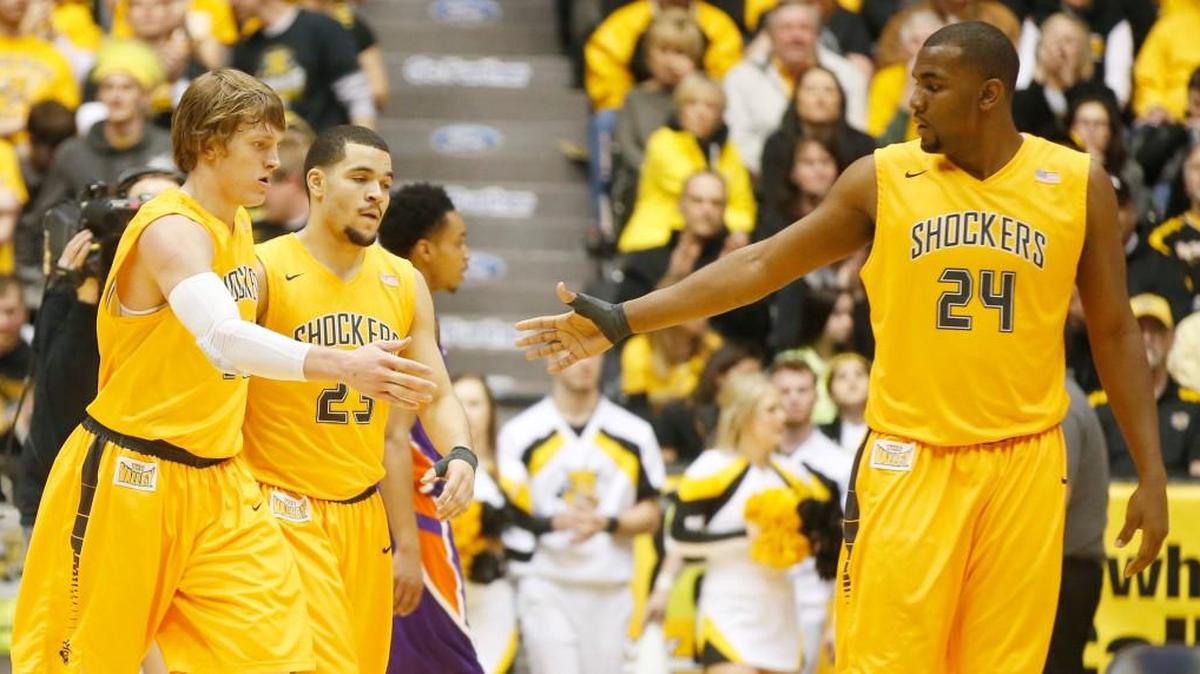 Ron Baker and Fred VanVleet, left, hope to get more productive minutes this season from teammate Shaquille Morris (24).