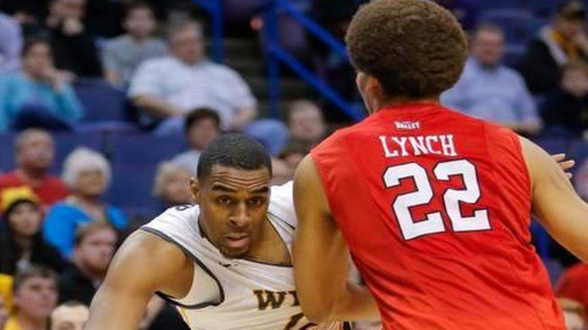 
Wichita State forward Darius Carter has his path blocked by Illinois State center Reggie Lynch during the first half of their semifinal game at the Scottrade Center in St. Louis on Saturday.
