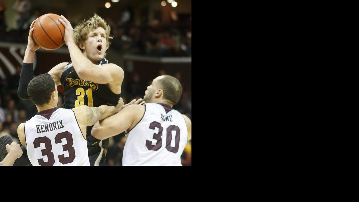
Wichita State's Ron Baker rebounds the ball against Missouri State;s Chris Kendrix and Camyn Boone in the first half at the JQH Arena in Springfield, MO., Wednesday. (Jan 21, 2015)
