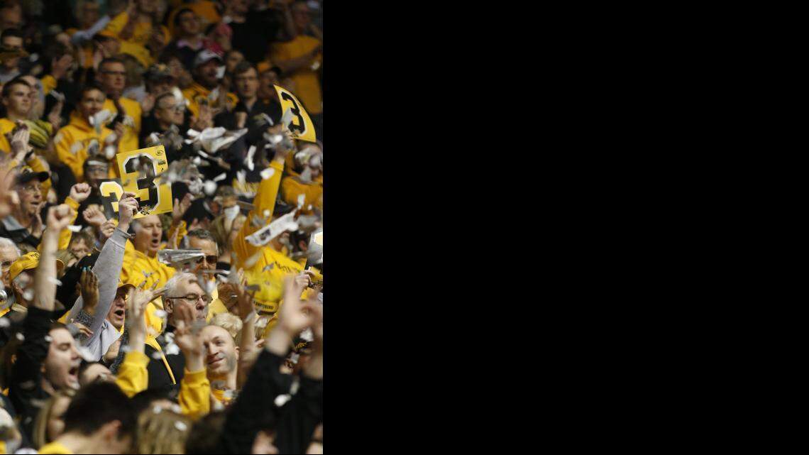 
The Wichita State crowd throws ripped newspaper into the air after the first basket is scored by Fred VanVleet against Evansville on Sunday. 

