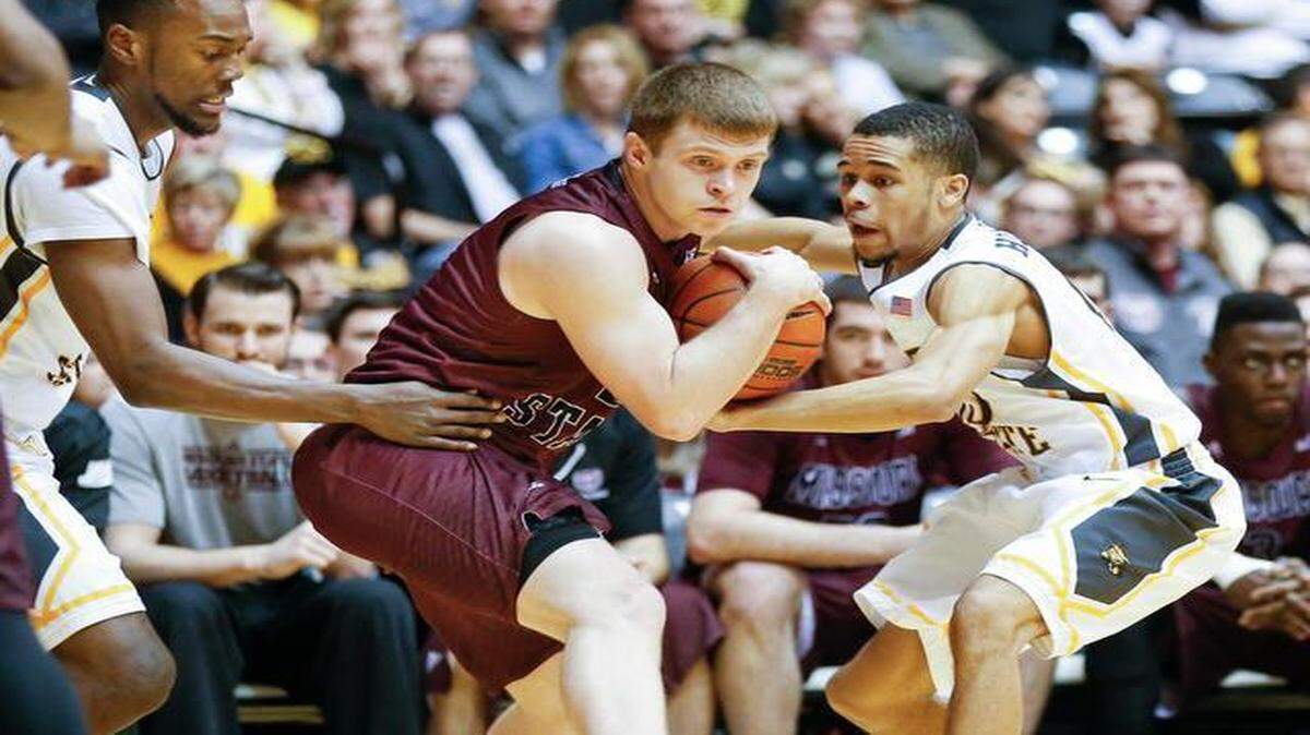 
Wichita State's Ria'n Holland , right, and Tevin Glass, left, pressure Missouri State's Austin Ruder during the first half Saturday at Koch Arena.
