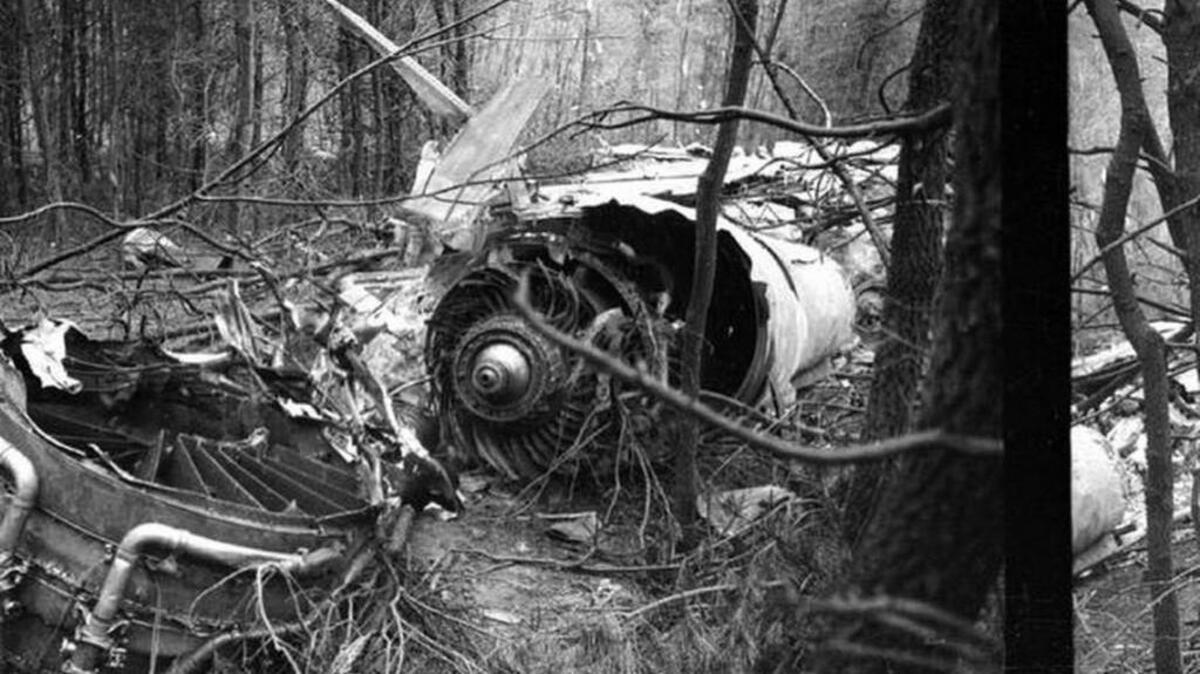 Parts of the engine from the Marshall University football team plane are scattered in the woods after the crash at the Tri-State Airport in Kenova, W.Va. on Nov. 14, 1970. The crash killed 75 people including players, coaches, administrators and fans.