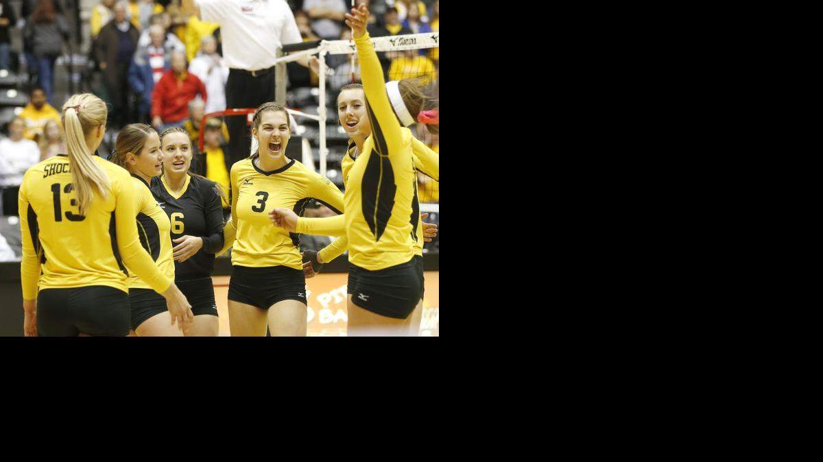 
Wichita State’s volleyball players celebrate after defeating Evansville in three sets Friday.

