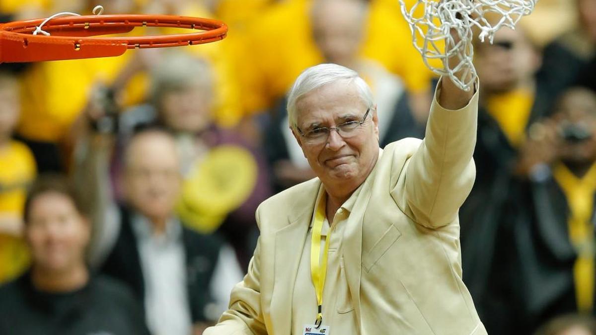 Wichita State president John Bardo cuts down the net after the Shockers locked up the Missouri Valley Conference title on Feb. 21, 2014, at Koch Arena.