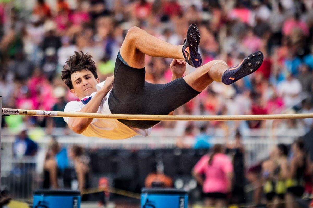 Wichita Trinity junior Jesse Eklund clears the bar during the Class 3A boys high jump at the Kansas high school state track and field meet Friday at Crossland Stadium. Eklund, a first-year jumper, won the state title by clearing 6 feet, 6 inches.